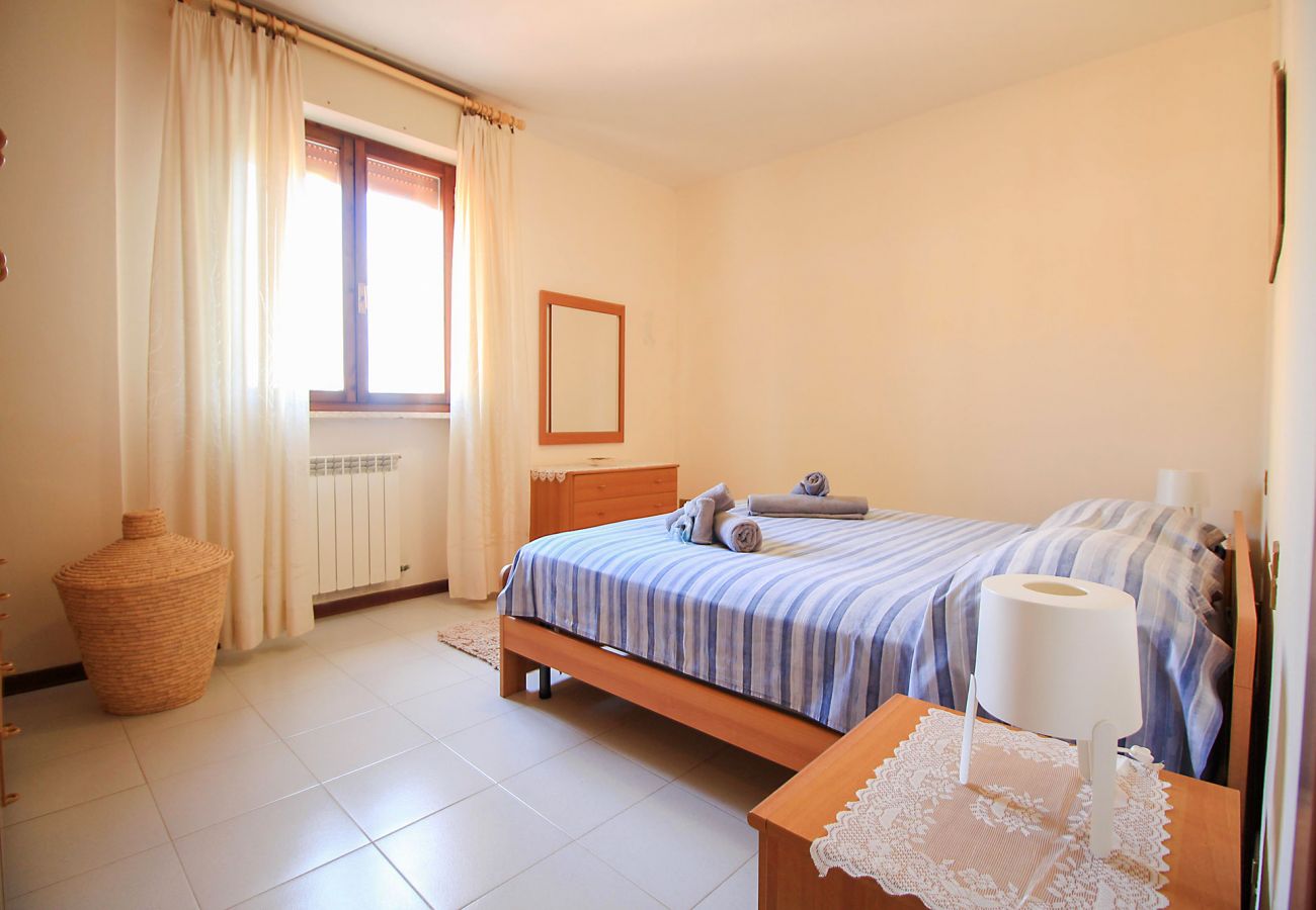 Porto Santo Stefano-Pozzarello Apartment - The master bedroom